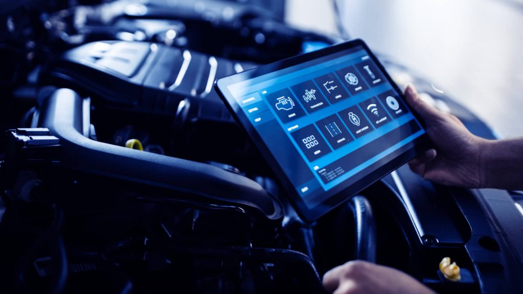 Specialist Inspecting the Vehicle in Order to Find Broken Components In the Engine Bay